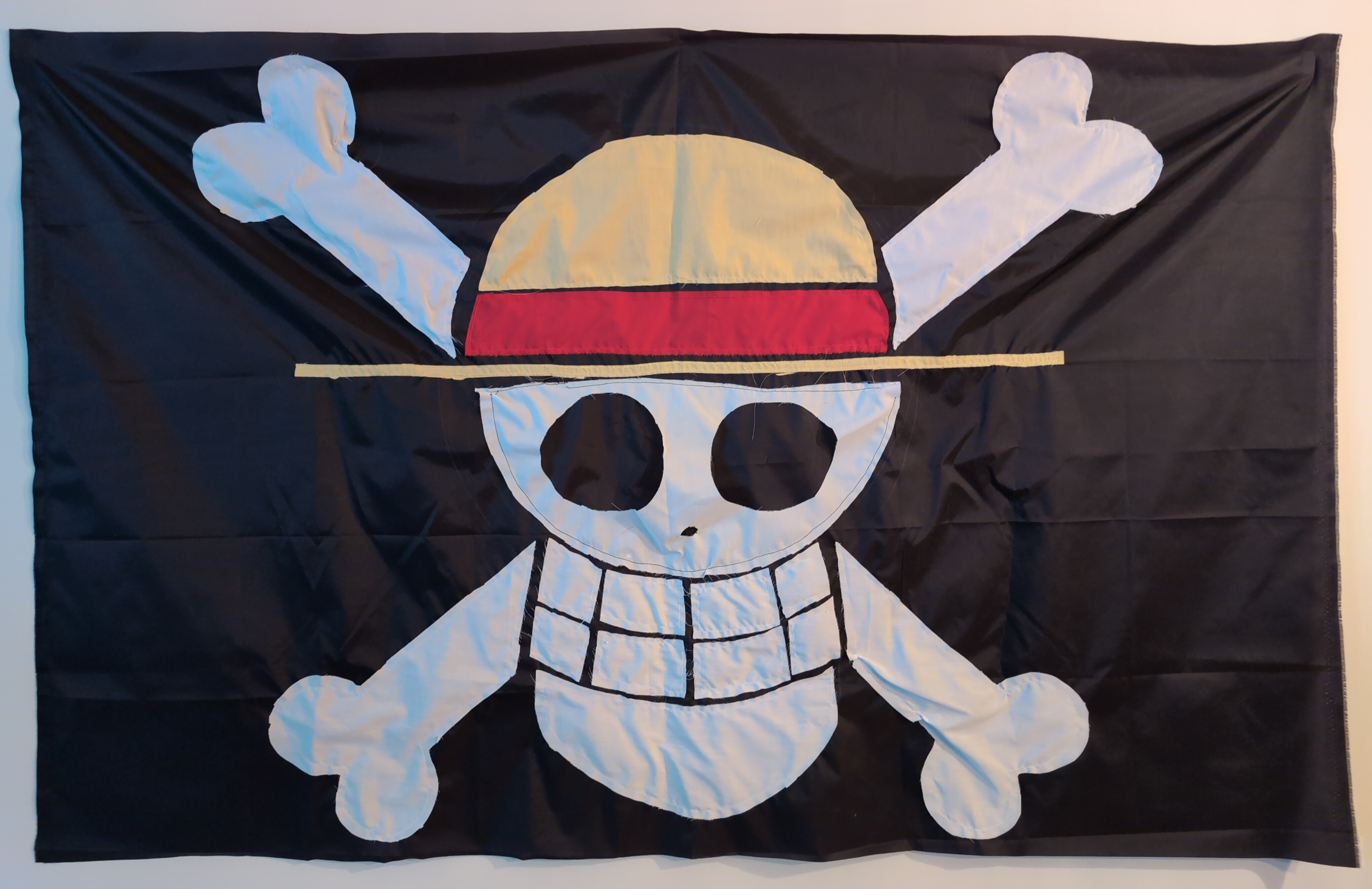 A photo of a somewhat disheveled flag of the strawhat pirates
